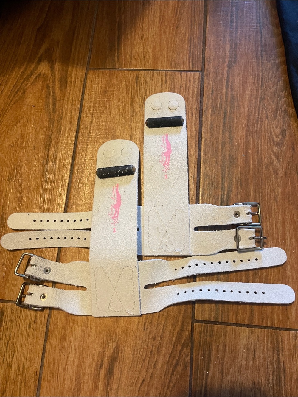 Nastia Luiken White leather gymnastics grips with pink logo